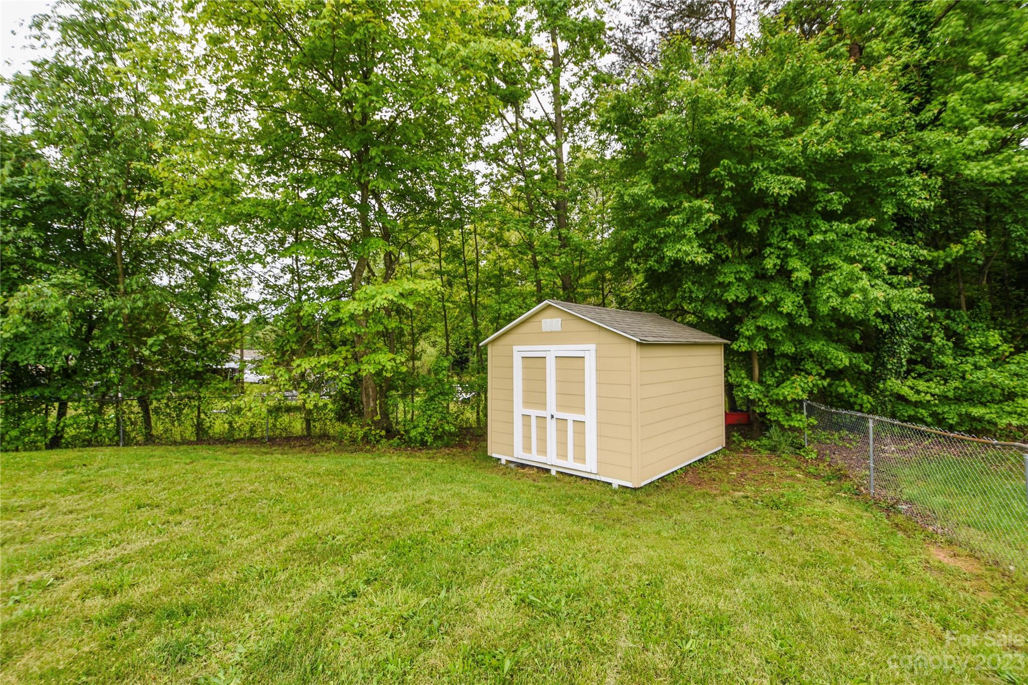 204 Springhill Lane Maiden, NC 28650 - Photo 19 of 20 a view of a backyard with large trees