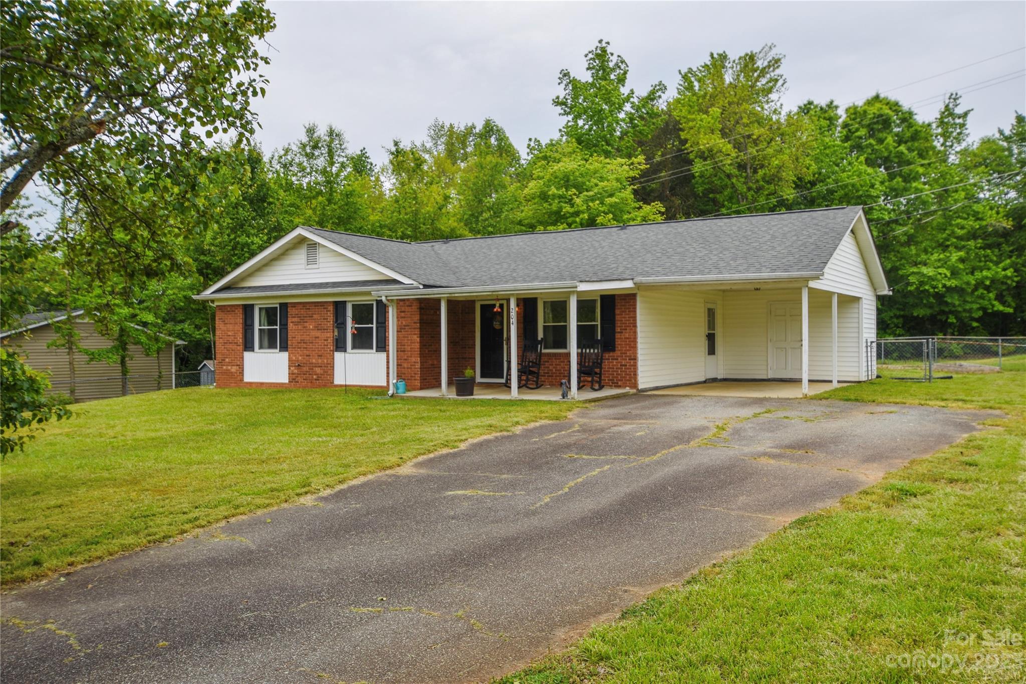 204 Springhill Lane Maiden, NC 28650 - Photo 2 of 20 a front view of a house with a garden