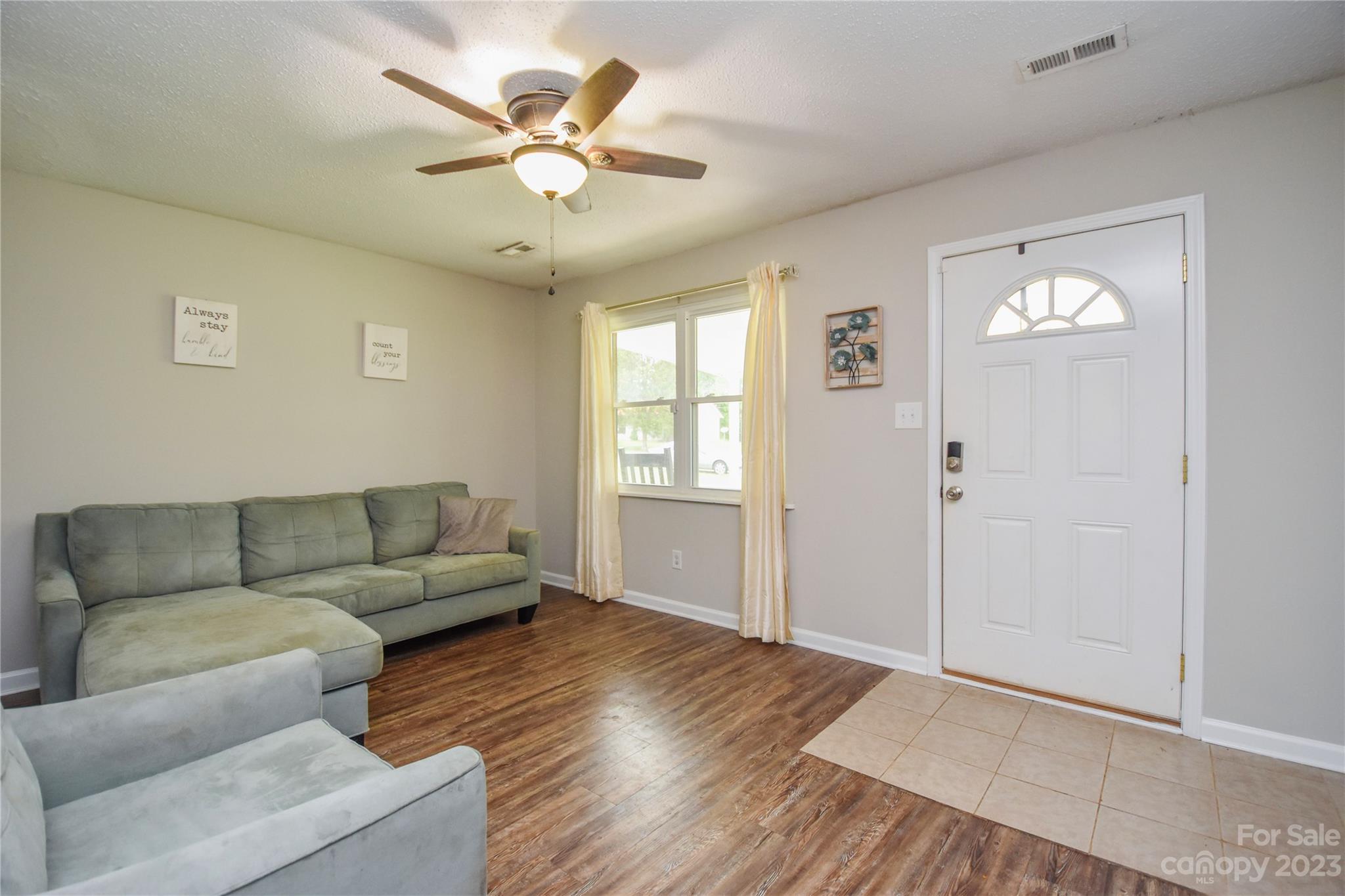 204 Springhill Lane Maiden, NC 28650 - Photo 4 of 20 a living room with furniture and a large window