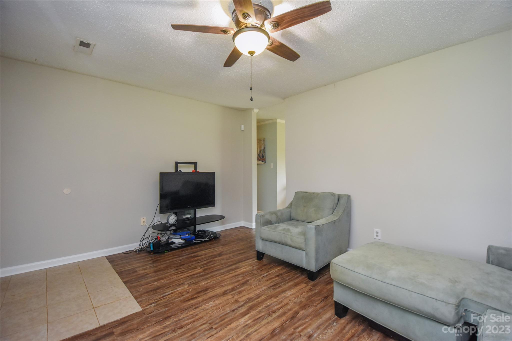 204 Springhill Lane Maiden, NC 28650 - Photo 5 of 20 a living room with furniture and a flat screen tv
