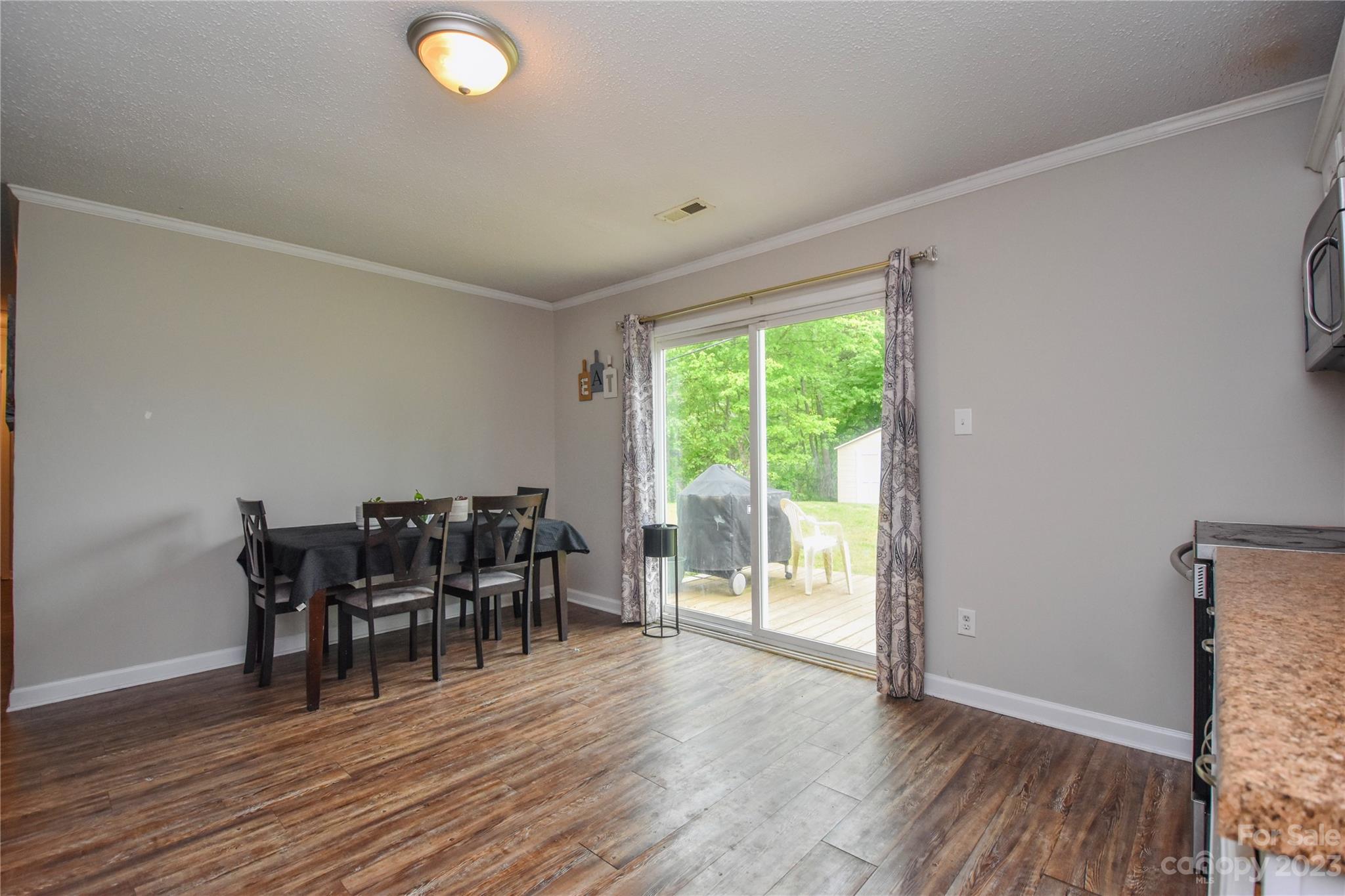 204 Springhill Lane Maiden, NC 28650 - Photo 7 of 20 a view of a dining room with furniture and wooden floor