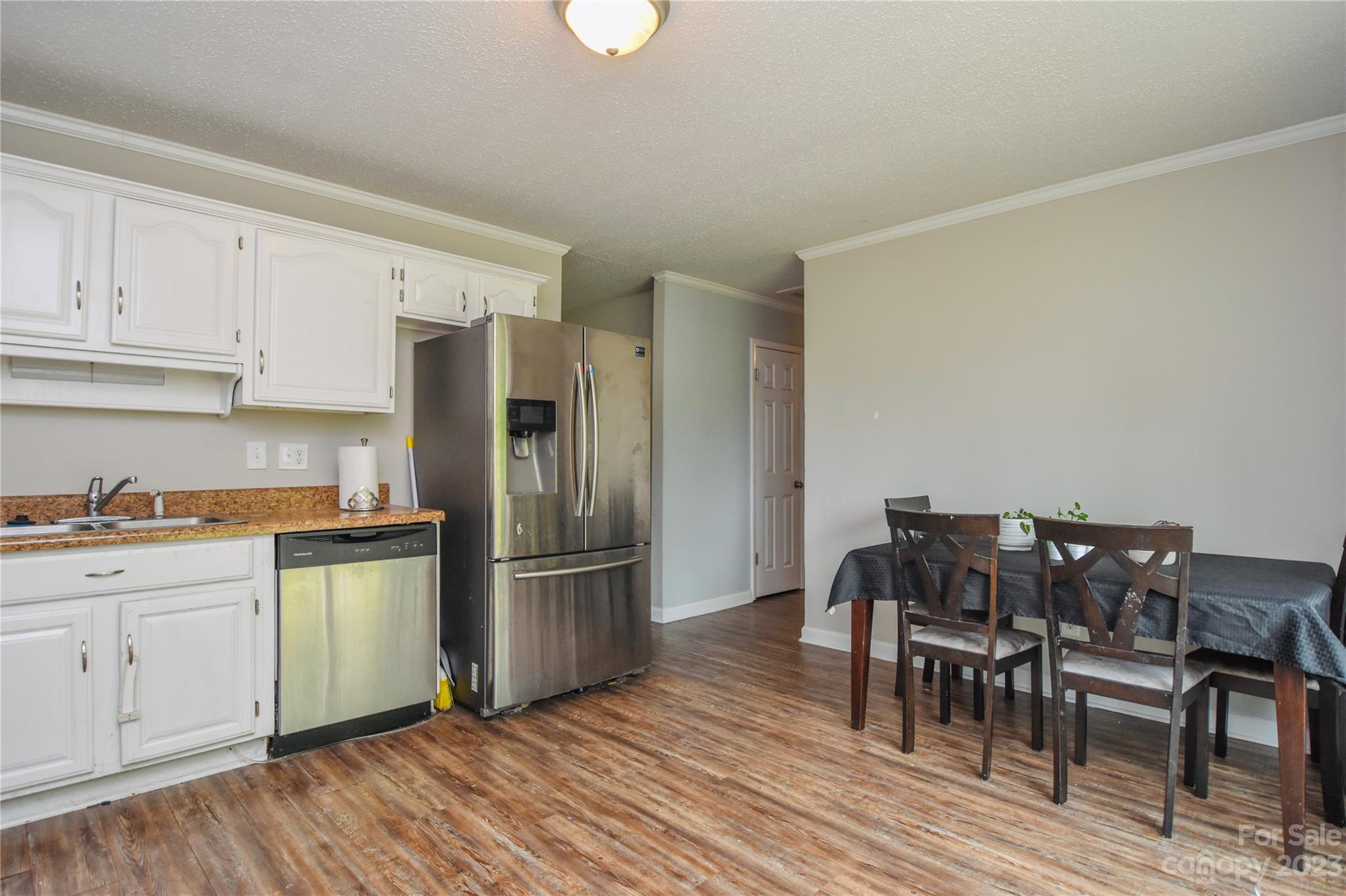 204 Springhill Lane Maiden, NC 28650 - Photo 8 of 20 a kitchen with stainless steel appliances granite countertop a refrigerator and a stove top oven