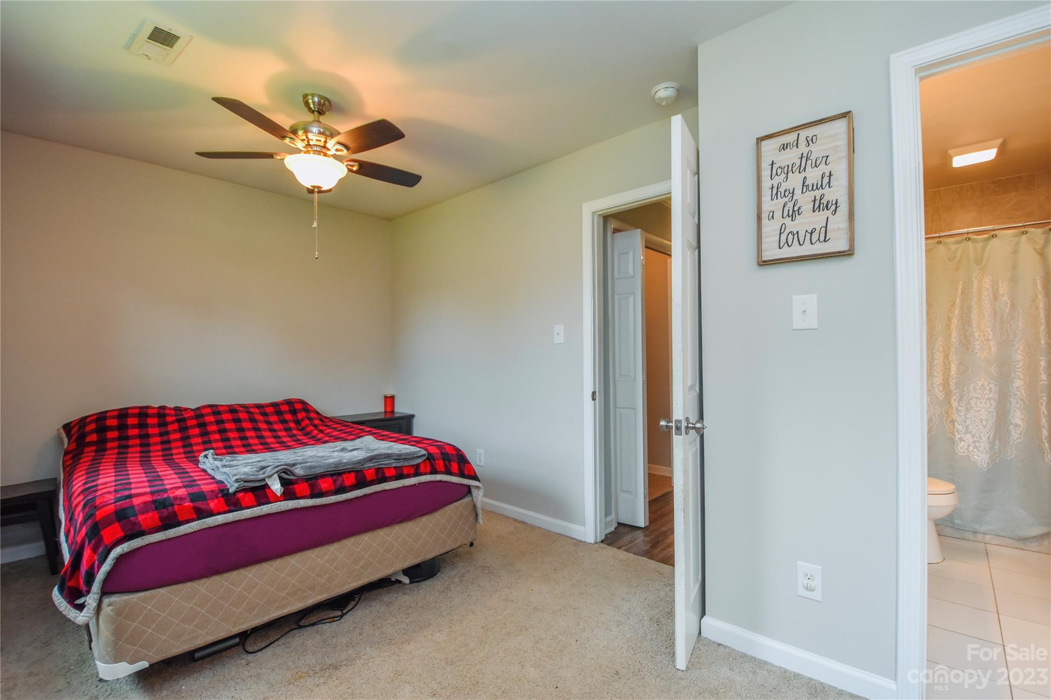 204 Springhill Lane Maiden, NC 28650 - Photo 9 of 20 a bedroom with a bed and a chandelier