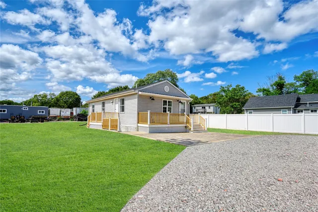 a view of backyard with green space