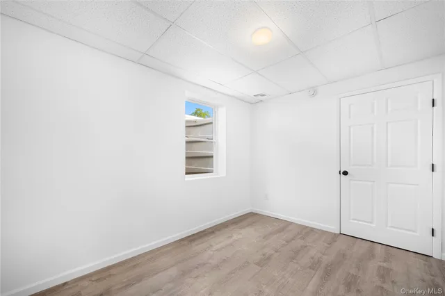 an empty room with a empty space and windows