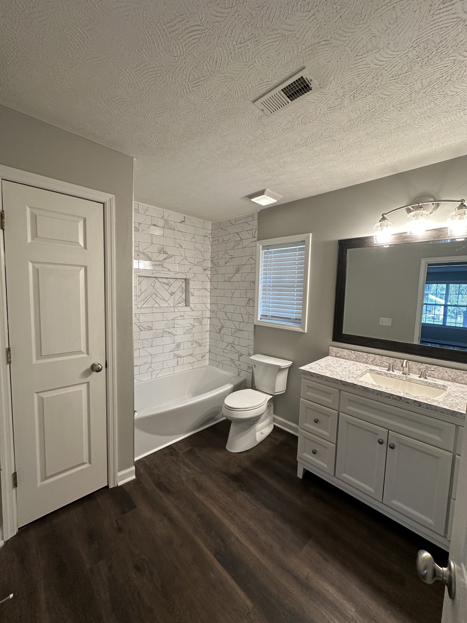 902 South Russell Street Portland, TN 37148 - Photo 13 of 13 a bathroom with a double vanity sink toilet and a mirror