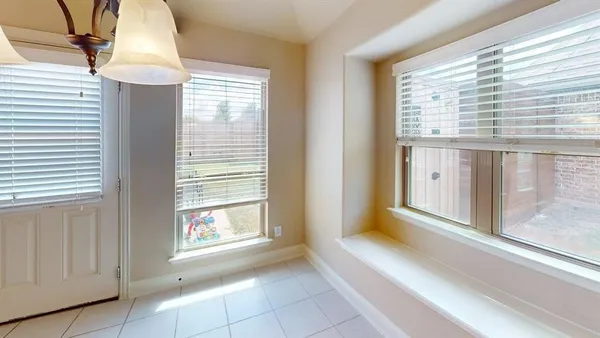 a view of a hallway with windows