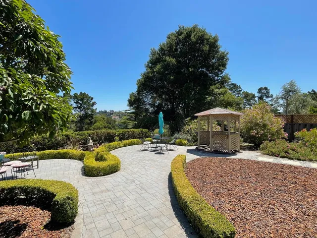 a view of a swimming pool with a patio