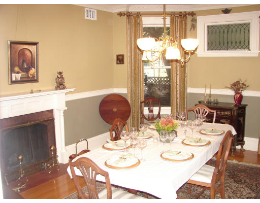 28 Westbourne Road Newton, MA 02459 - Photo 8 of 20 a dining room with wooden floor a chandelier a glass table and chairs