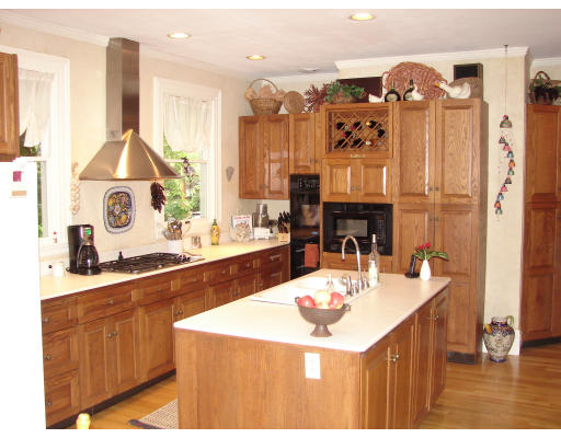 28 Westbourne Road Newton, MA 02459 - Photo 9 of 20 a kitchen with a sink a stove and chairs