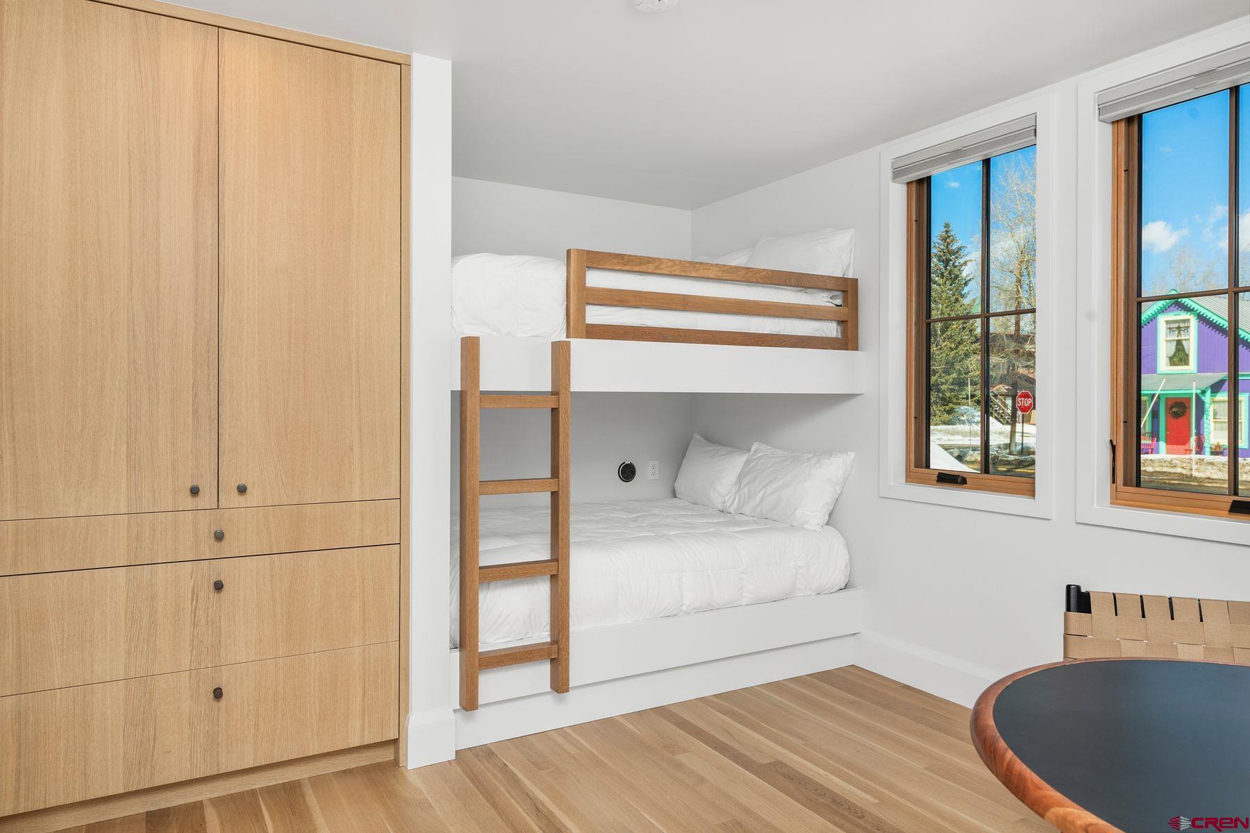 304 2nd Street Crested Butte, CO 81224 - Photo 14 of 37 a bedroom with a bed and a window