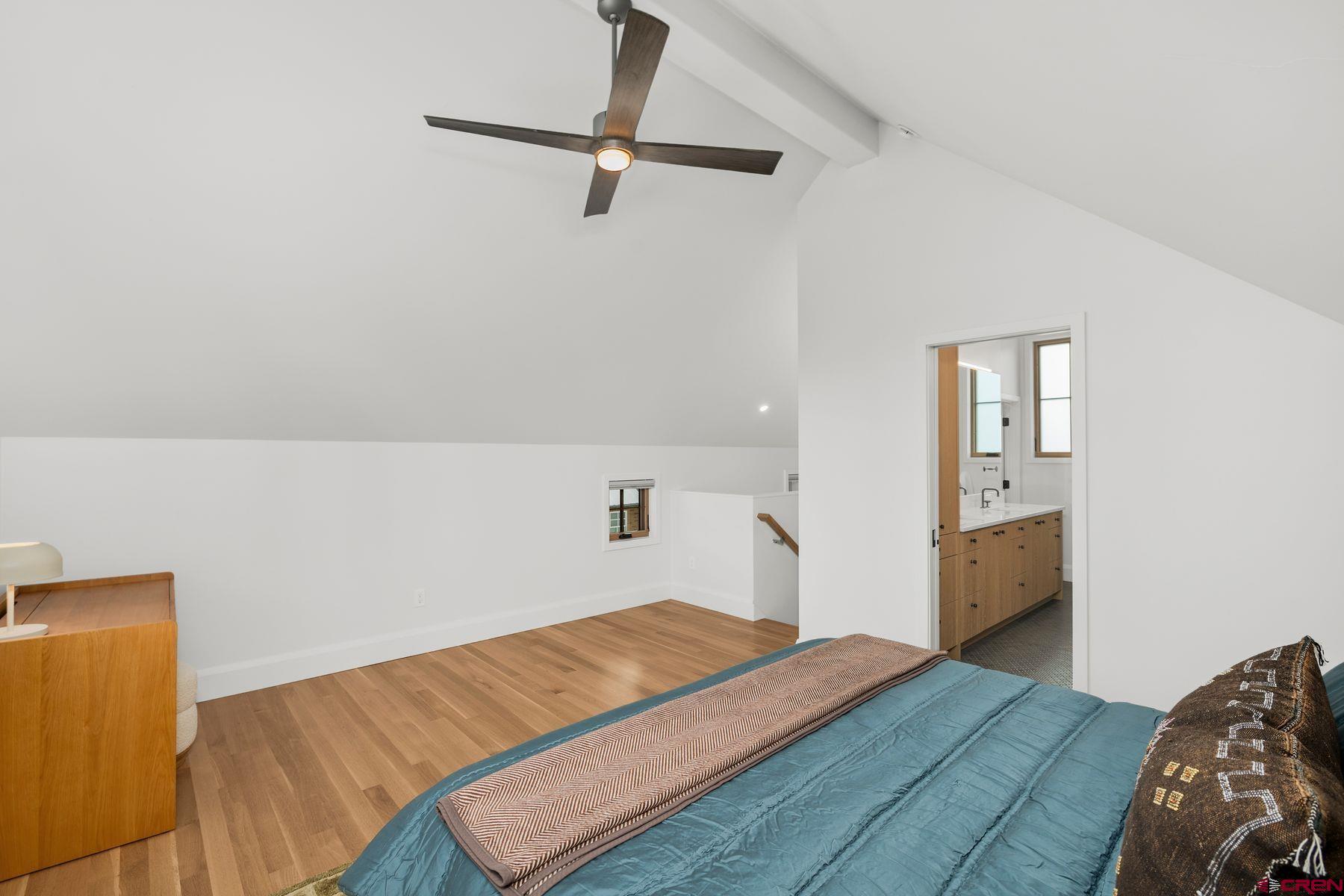 304 2nd Street Crested Butte, CO 81224 - Photo 20 of 37 a bedroom with a bed and a night stand