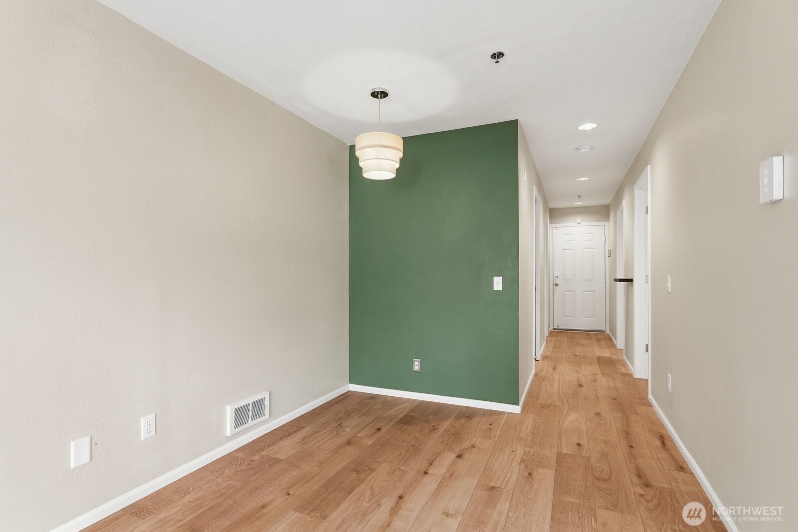 2116 California Avenue Southwest, Unit 201 Seattle, WA 98116 - Photo 14 of 33 a view of a hallway with wooden floor