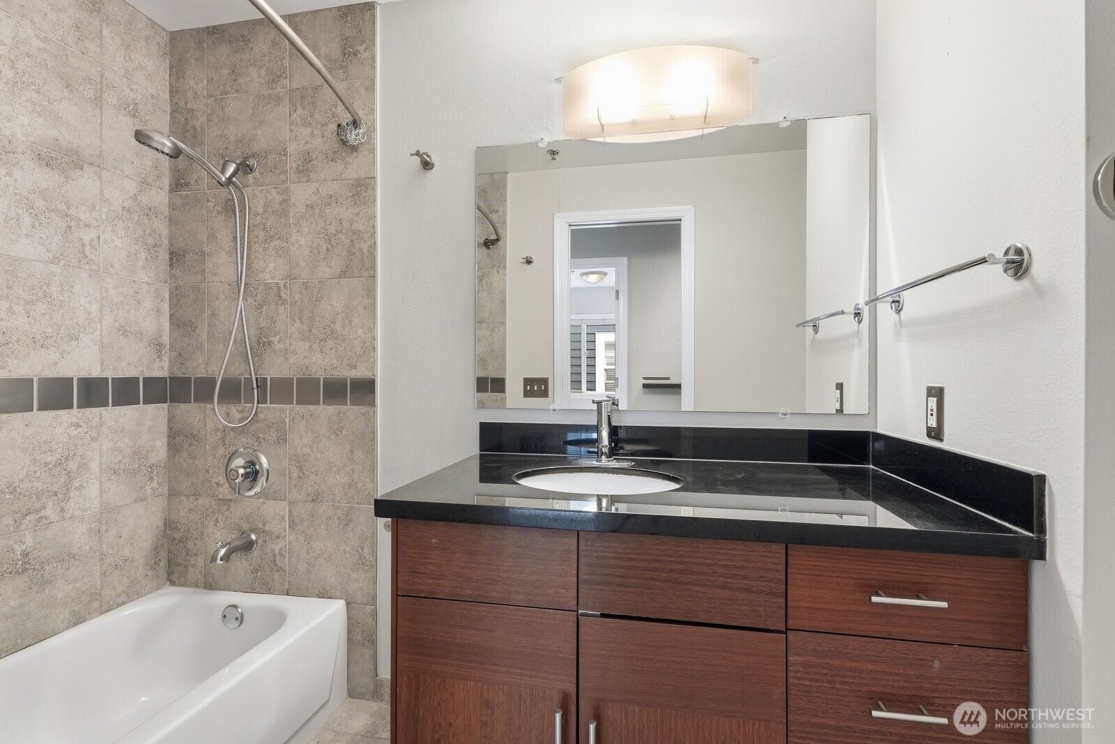 2116 California Avenue Southwest, Unit 201 Seattle, WA 98116 - Photo 24 of 33 a bathroom with a granite countertop sink a toilet and bathtub