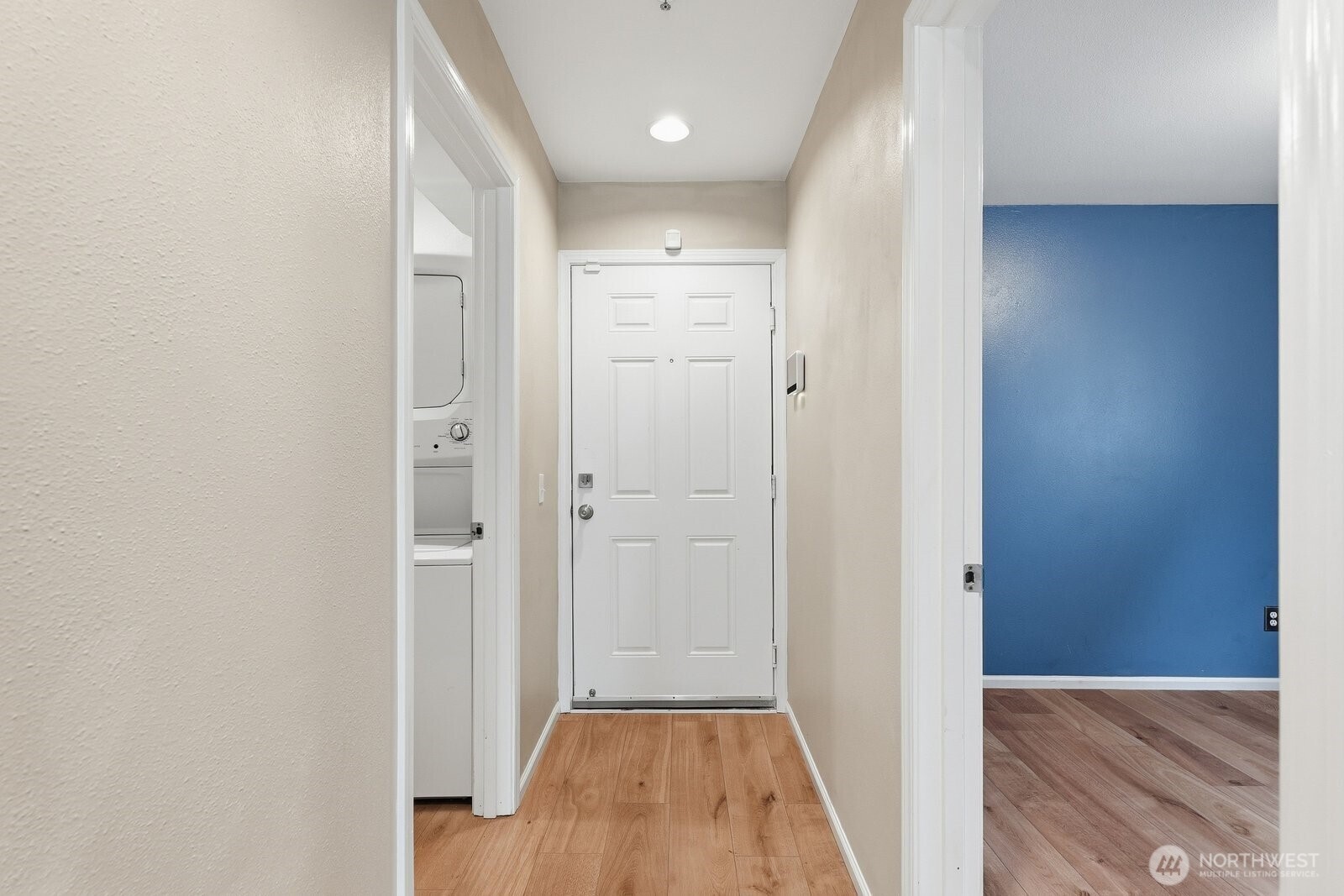 2116 California Avenue Southwest, Unit 201 Seattle, WA 98116 - Photo 25 of 33 a view of a hallway with wooden floor and a bathroom