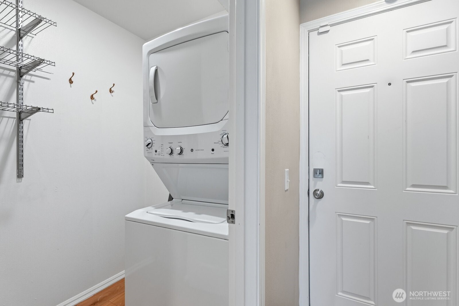 2116 California Avenue Southwest, Unit 201 Seattle, WA 98116 - Photo 26 of 33 a bathroom with a sink a toilet and mirror