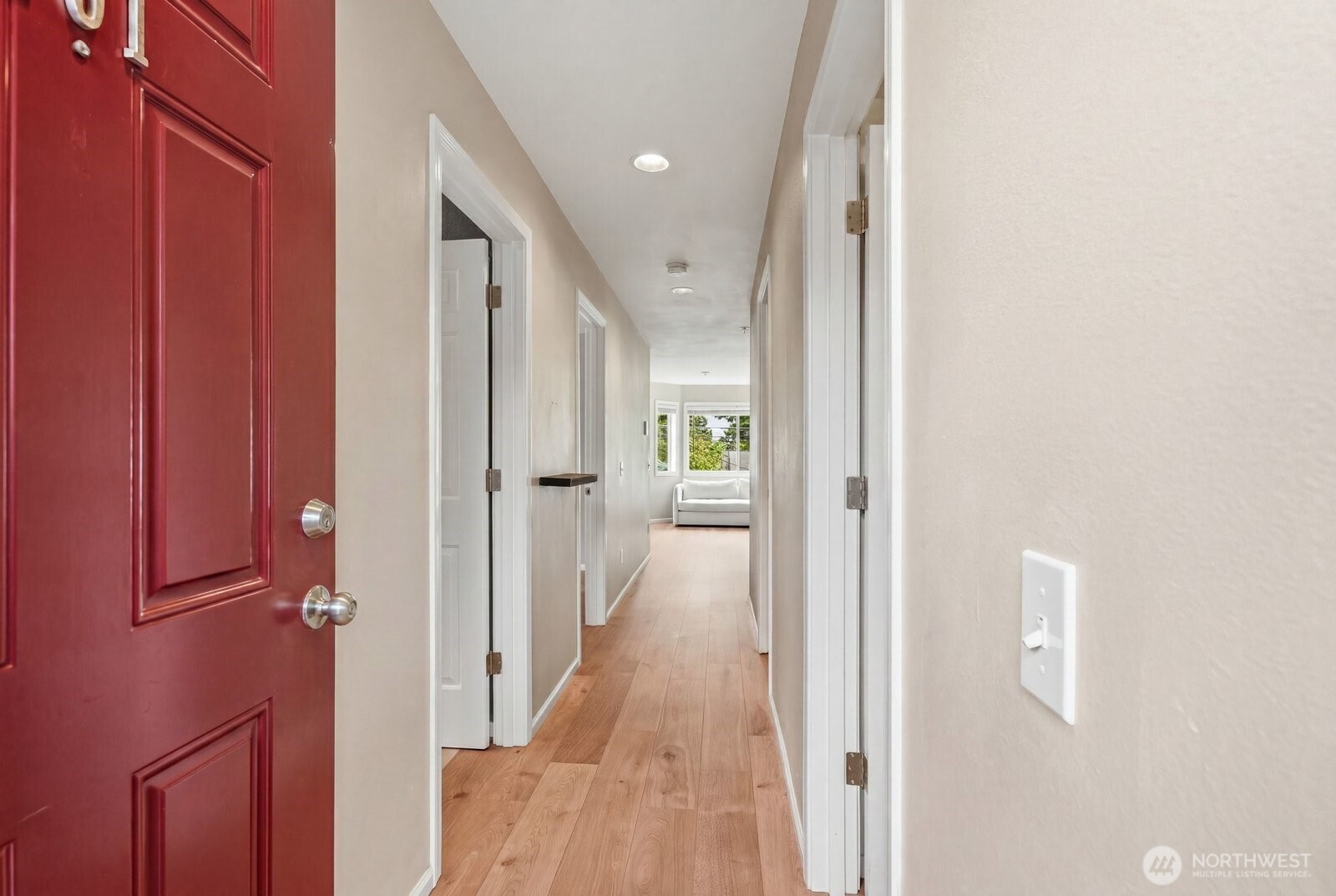 2116 California Avenue Southwest, Unit 201 Seattle, WA 98116 - Photo 4 of 33 a view of a hallway with wooden floor