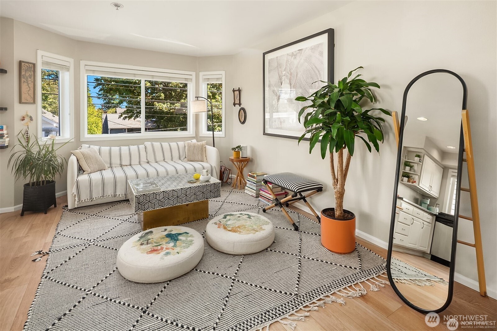2116 California Avenue Southwest, Unit 201 Seattle, WA 98116 - Photo 7 of 33 a living room with furniture and a potted plant