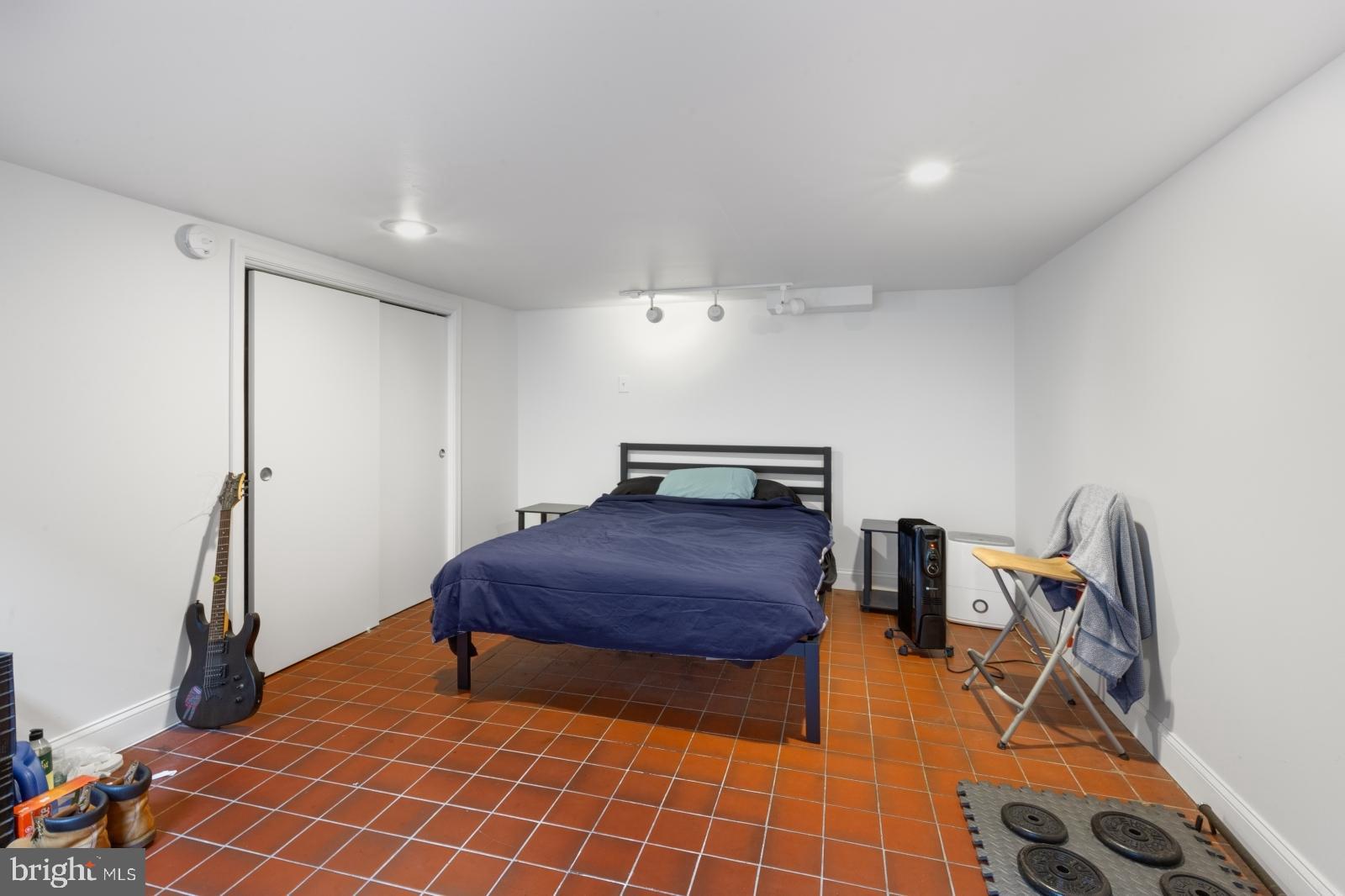 515 South 6th Street, Unit 1R Philadelphia, PA 19147 - Photo 8 of 17 a room with gym equipment and wooden floor