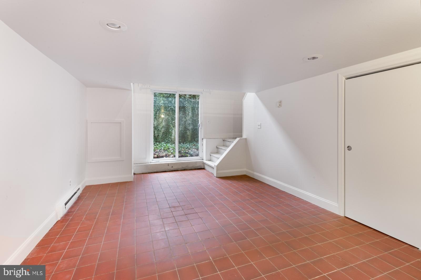 515 South 6th Street, Unit 1R Philadelphia, PA 19147 - Photo 9 of 17 a view of an empty room with wooden floor and a window