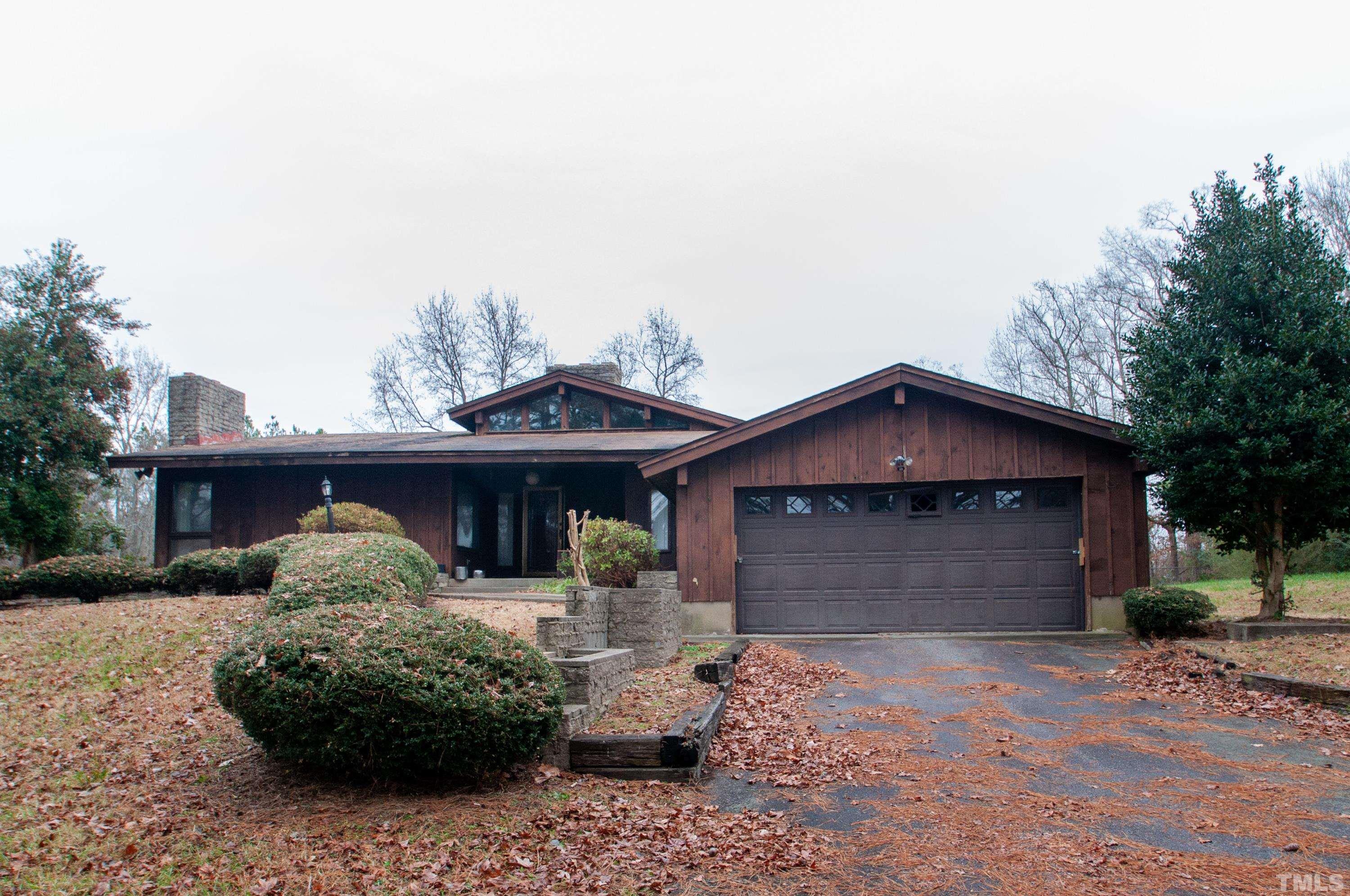 610 Flemingtown Road Henderson, NC 27537 - Photo 1 of 14 a front view of a house with a yard