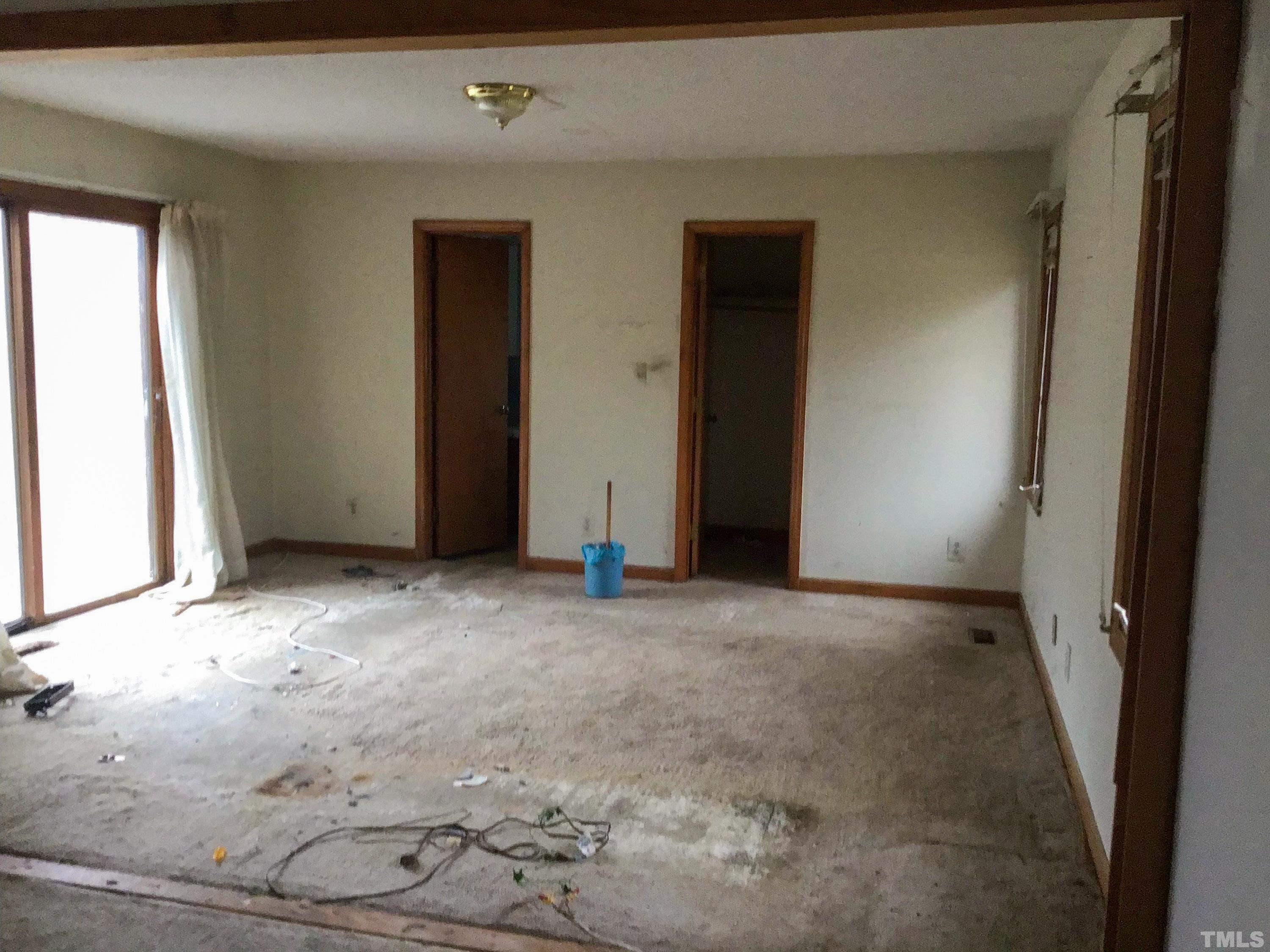 610 Flemingtown Road Henderson, NC 27537 - Photo 11 of 14 an empty room with windows