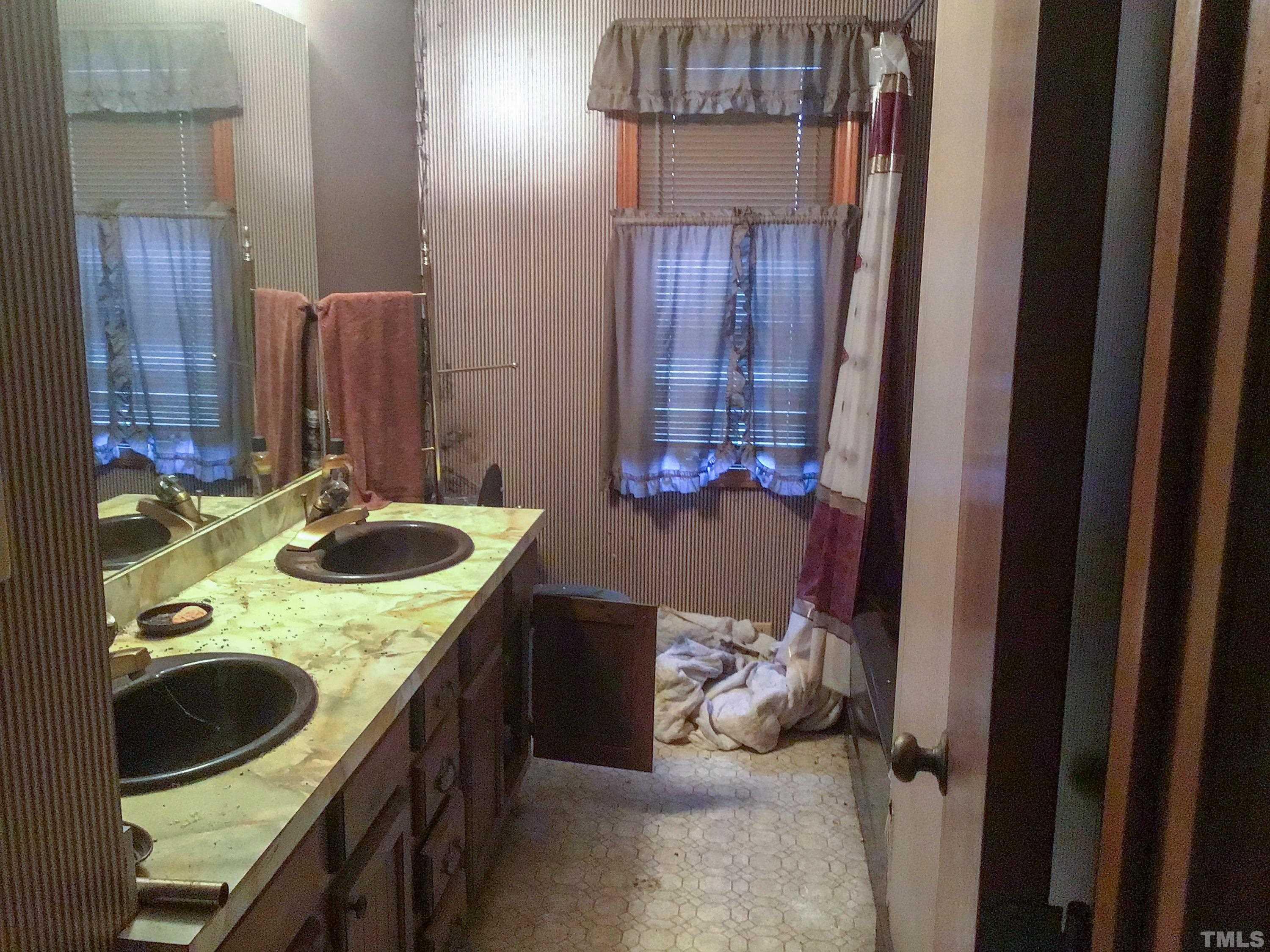 610 Flemingtown Road Henderson, NC 27537 - Photo 12 of 14 a kitchen with a sink and a stove