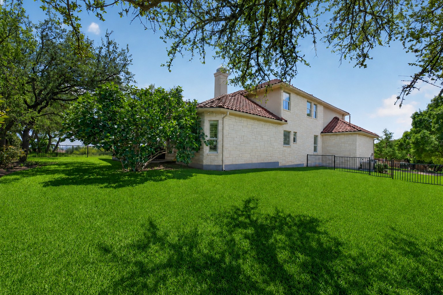 14608 Spillman Ranch Loop Austin, TX 78738 - Photo 29 of 31 a house view with a garden space