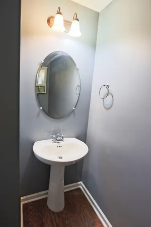 a bathroom with a sink and mirror
