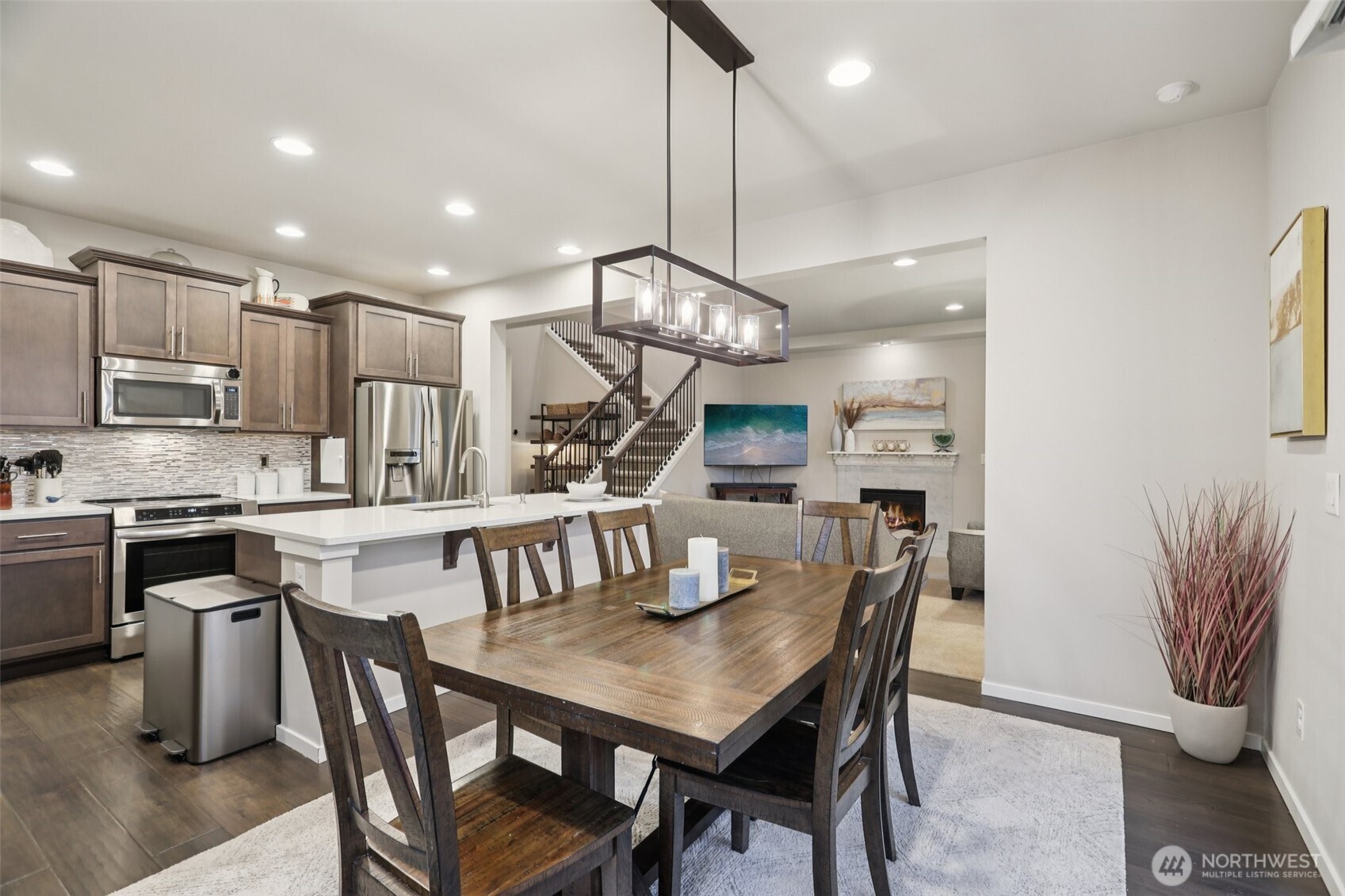 18533 115th Place Southeast Renton, WA 98055 - Photo 11 of 30 a kitchen with a table chairs refrigerator and microwave