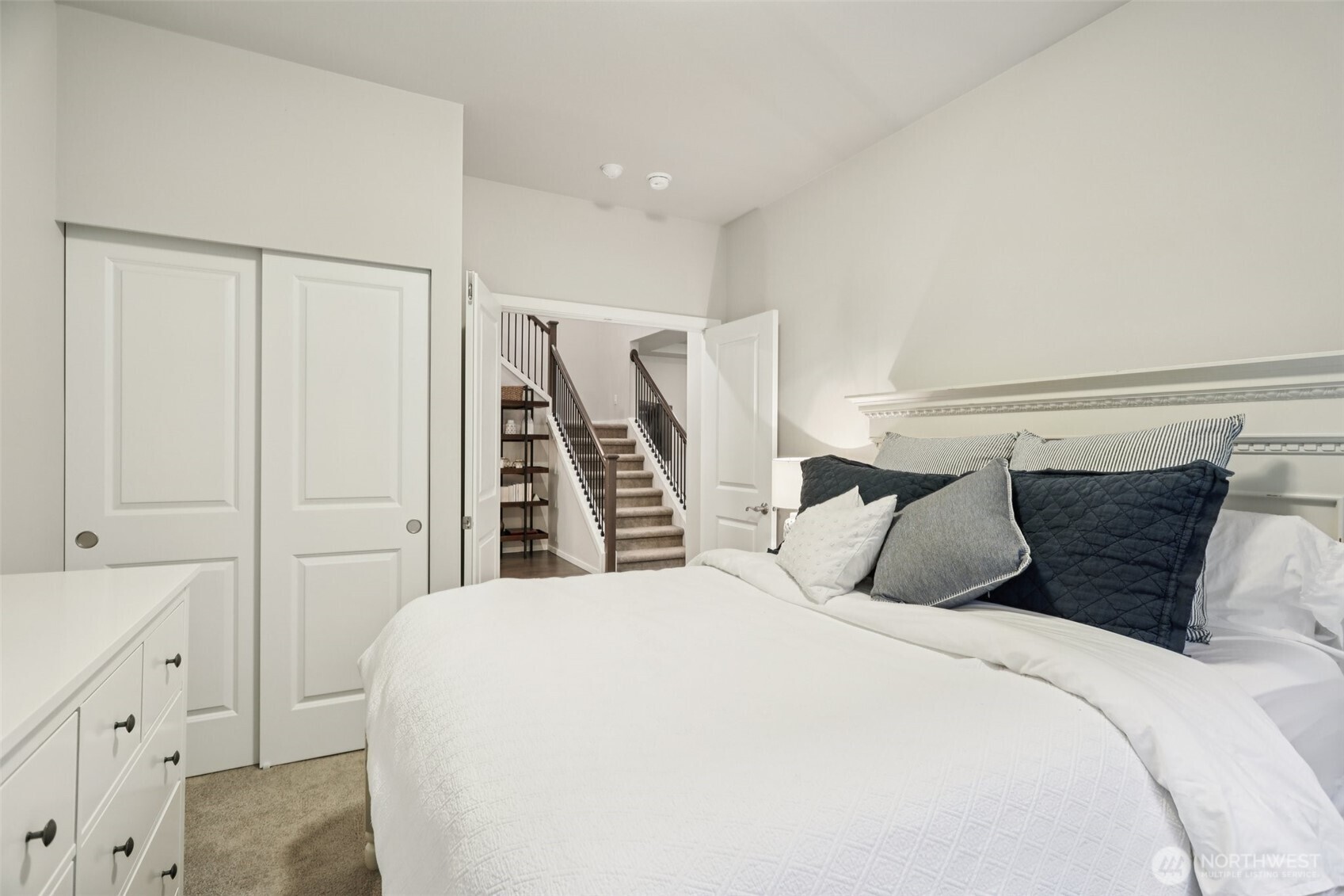 18533 115th Place Southeast Renton, WA 98055 - Photo 14 of 30 a bedroom with a large bed and a window