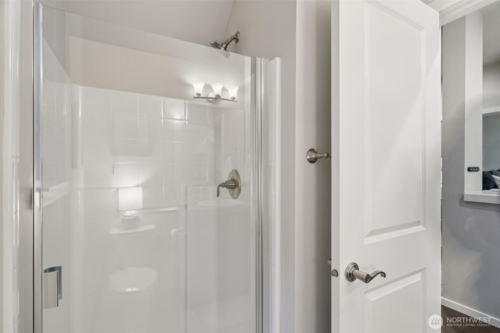 18533 115th Place Southeast Renton, WA 98055 - Photo 16 of 30 a bathroom with a glass shower door