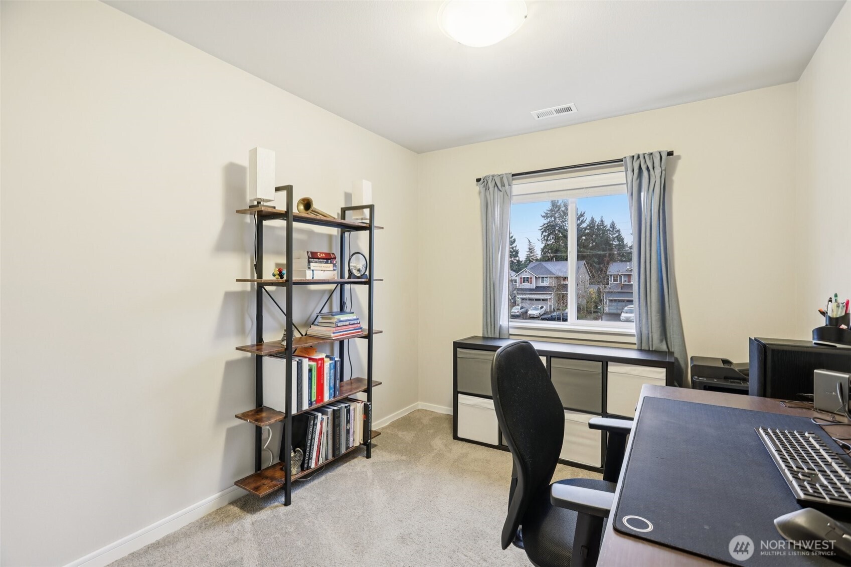 18533 115th Place Southeast Renton, WA 98055 - Photo 26 of 30 a view of a workspace with furniture and a window
