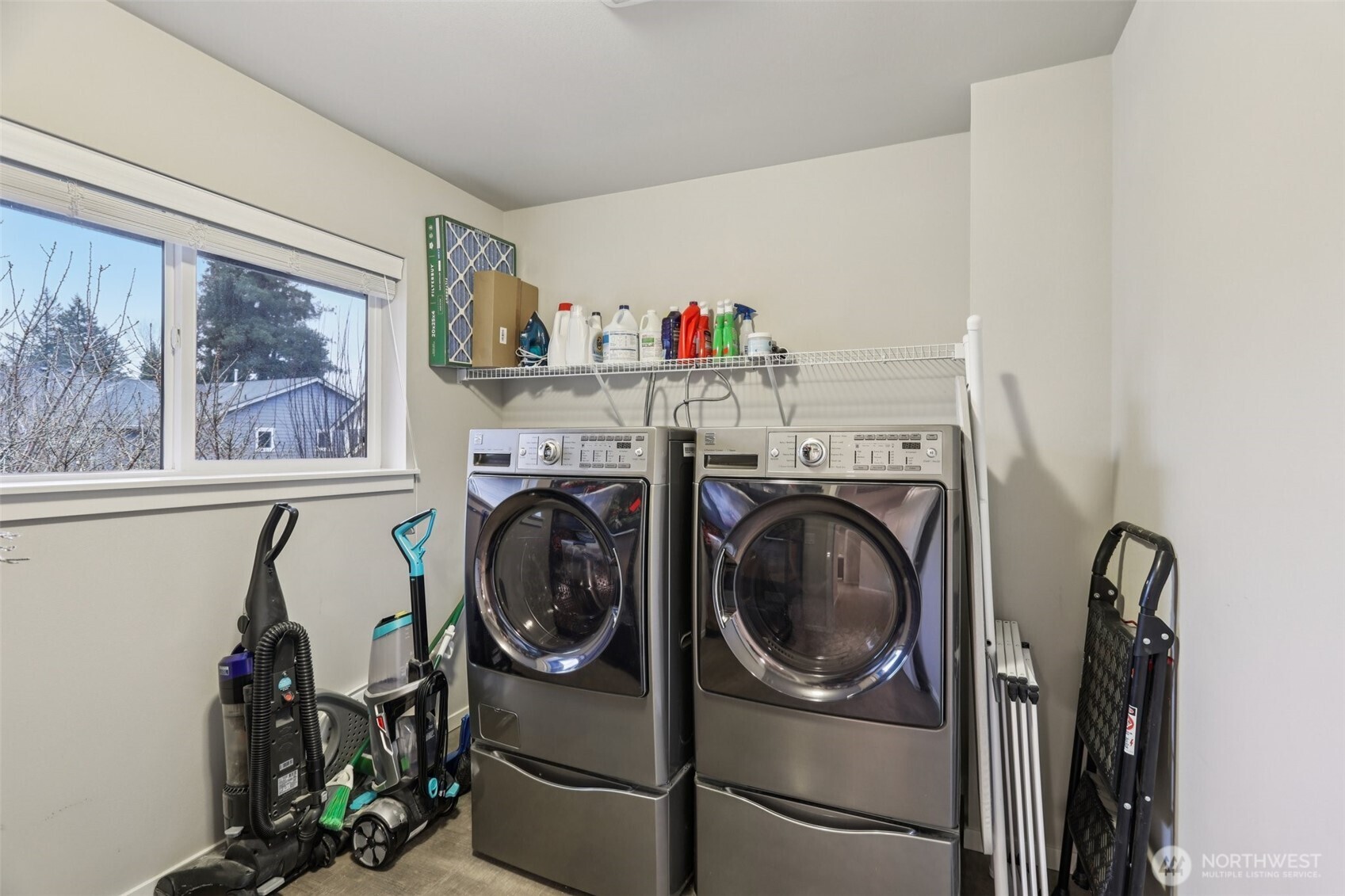 18533 115th Place Southeast Renton, WA 98055 - Photo 27 of 30 a utility room with dryer washer and a view of living room