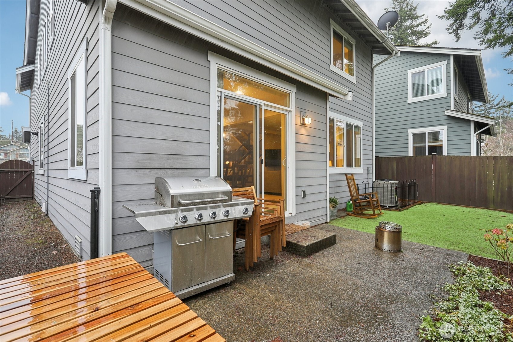 18533 115th Place Southeast Renton, WA 98055 - Photo 29 of 30 a backyard of a house with a garden and barbeque oven
