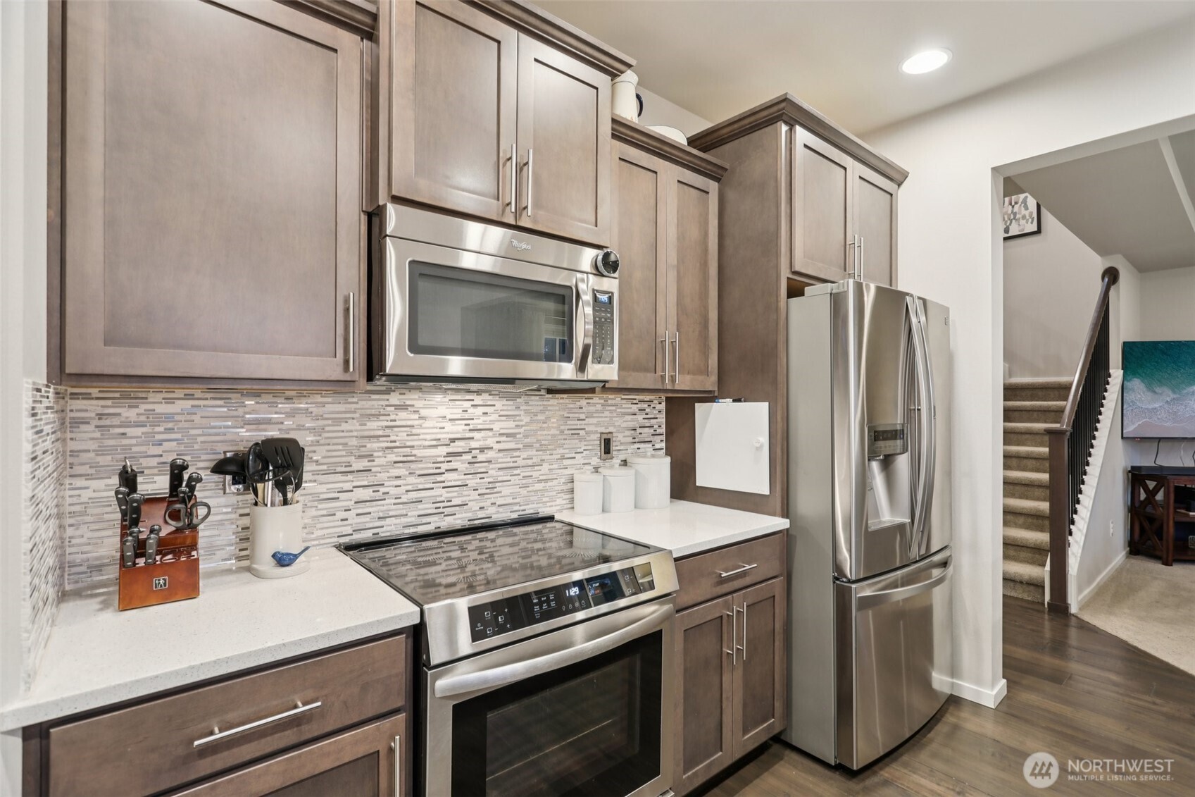 18533 115th Place Southeast Renton, WA 98055 - Photo 9 of 30 a kitchen with stainless steel appliances a refrigerator stove and microwave