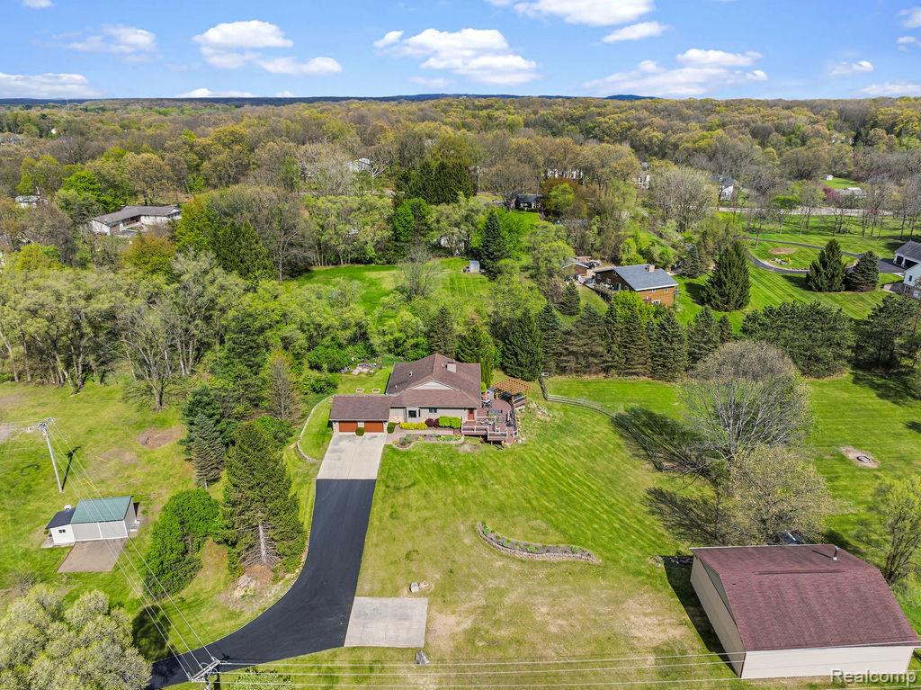 8742 Hyne Road Brighton, MI 48114 - Photo 59 of 65 Aerial view of a heavily wooded area