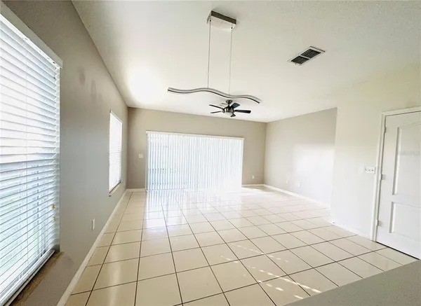 a view of an empty room and a window