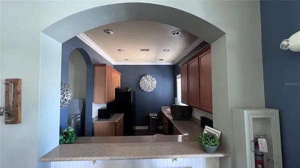 a view of a livingroom with furniture and windows