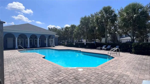 a view of a lake with houses in the back