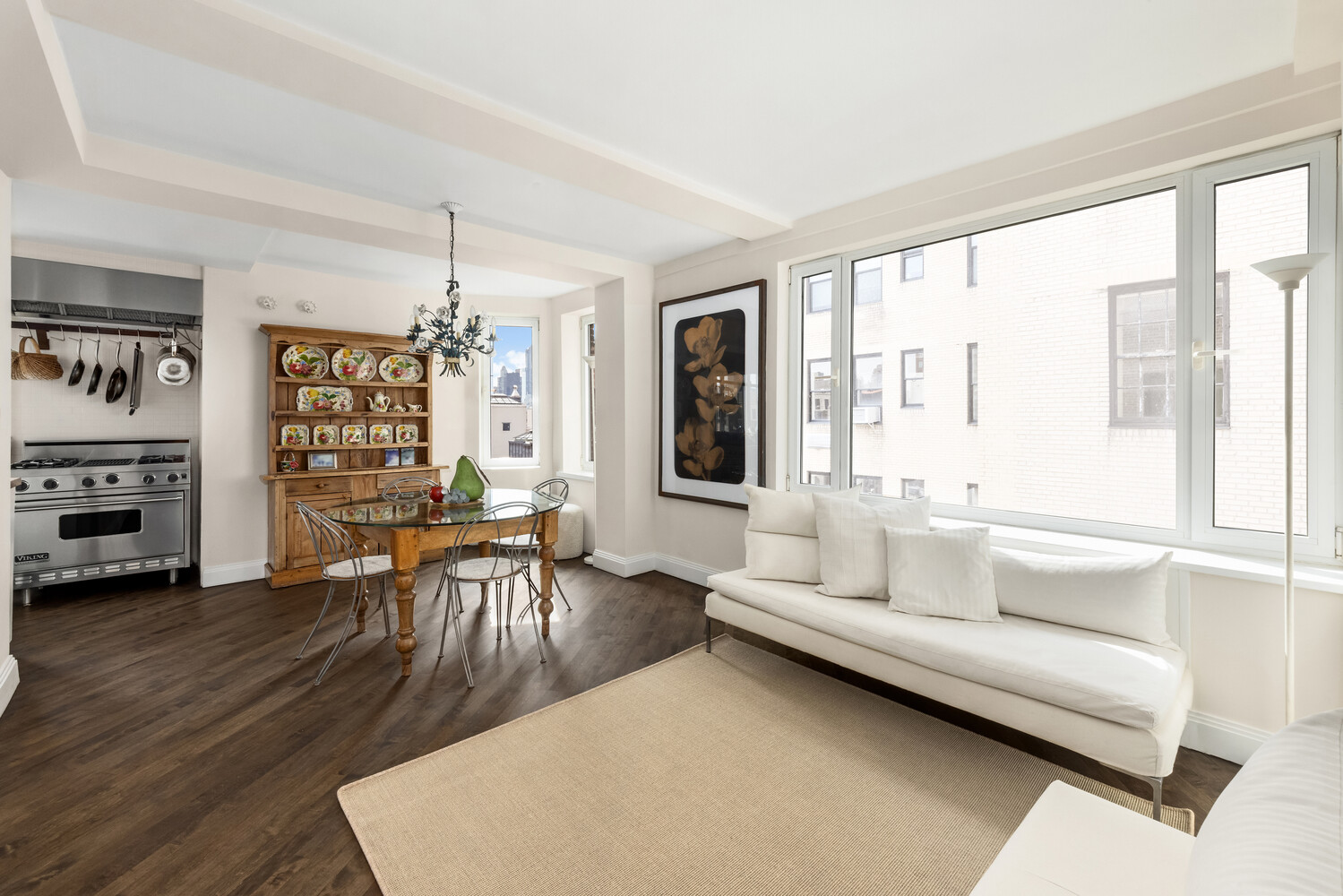 120 East 79th Street, Unit PH20 Manhattan, NY 10075 - Photo 13 of 20 a living room with furniture and a wooden floor