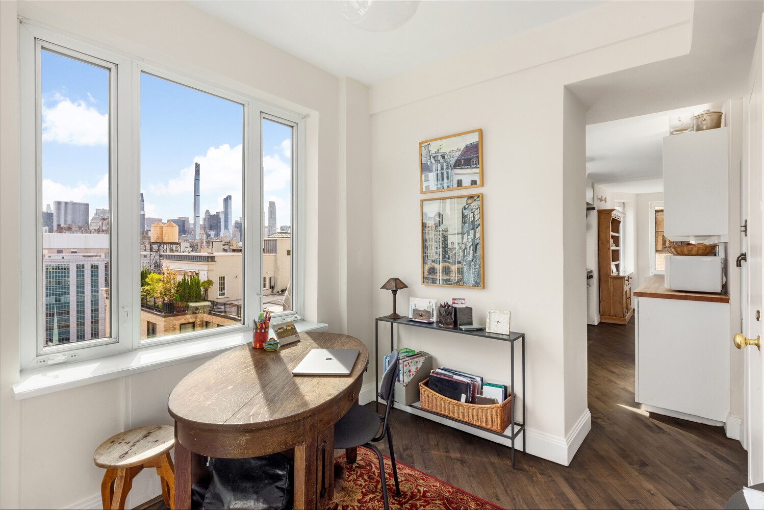 120 East 79th Street, Unit PH20 Manhattan, NY 10075 - Photo 18 of 20 a living room with furniture and a wooden floor