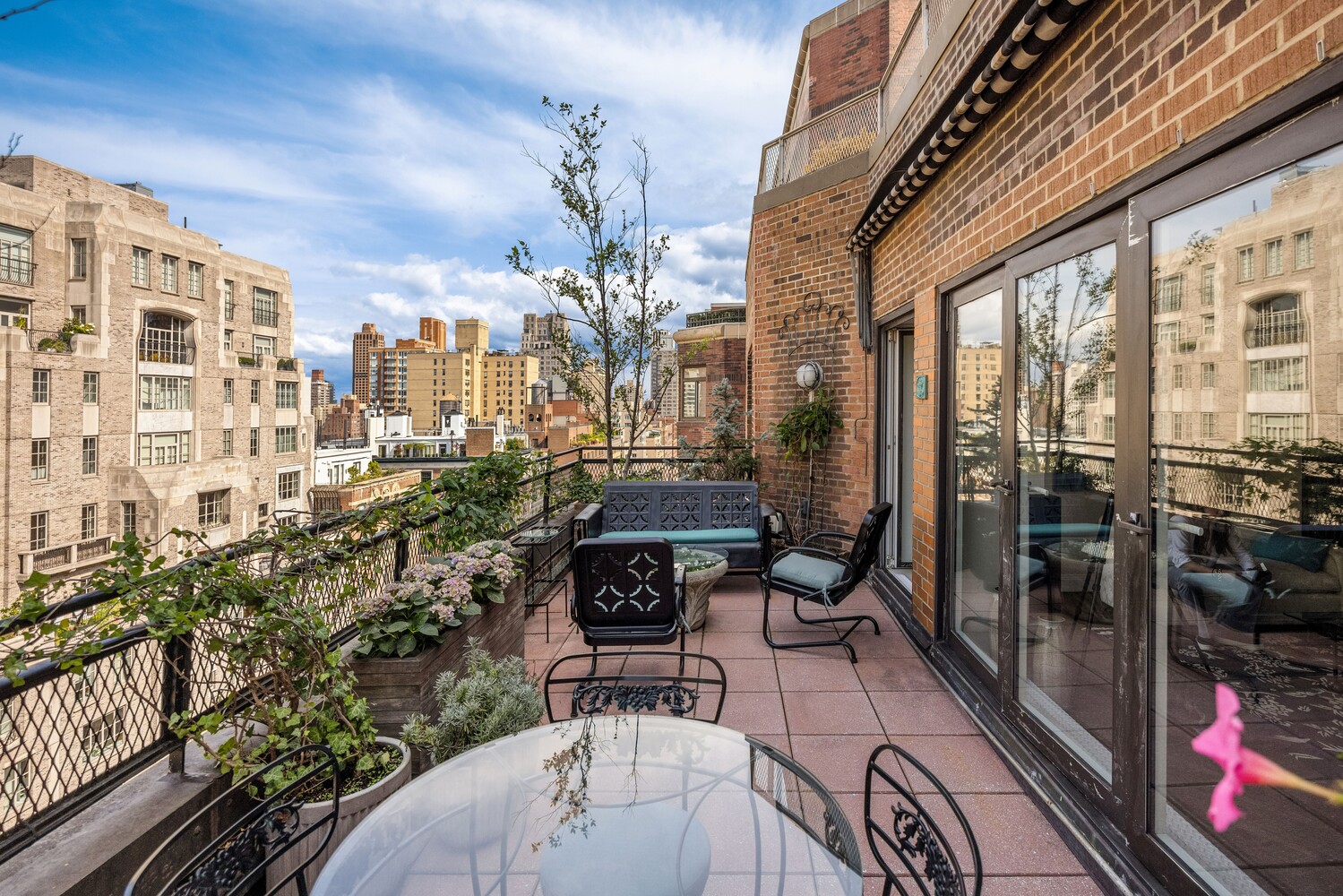 120 East 79th Street, Unit PH20 Manhattan, NY 10075 - Photo 4 of 20 a view of a balcony with chairs