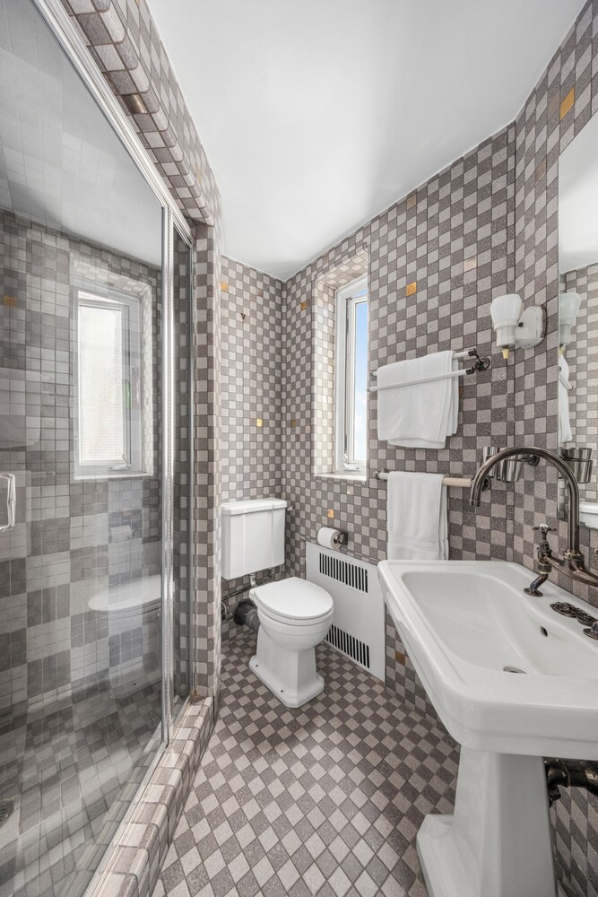 120 East 79th Street, Unit PH20 Manhattan, NY 10075 - Photo 8 of 20 a bathroom with a sink toilet and shower