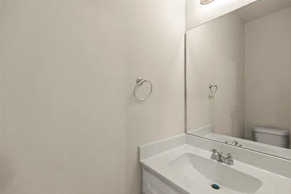 a bathroom with a sink and mirror