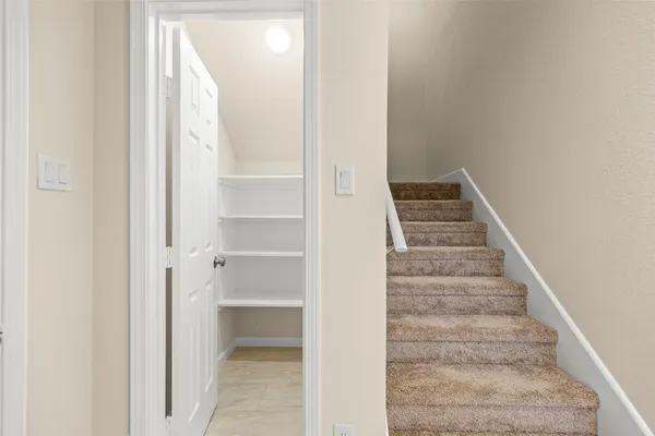 a view of a hallway with staircase
