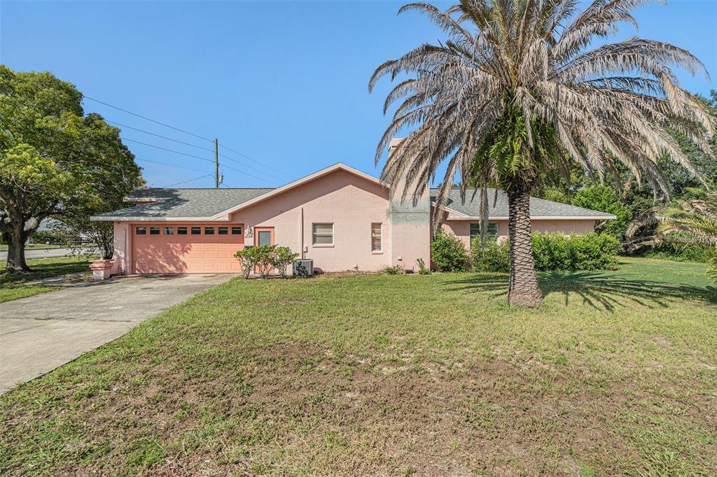 4355 Odin Street Spring Hill, FL 34608 - Photo 1 of 1 a view of a house with a yard and sitting area