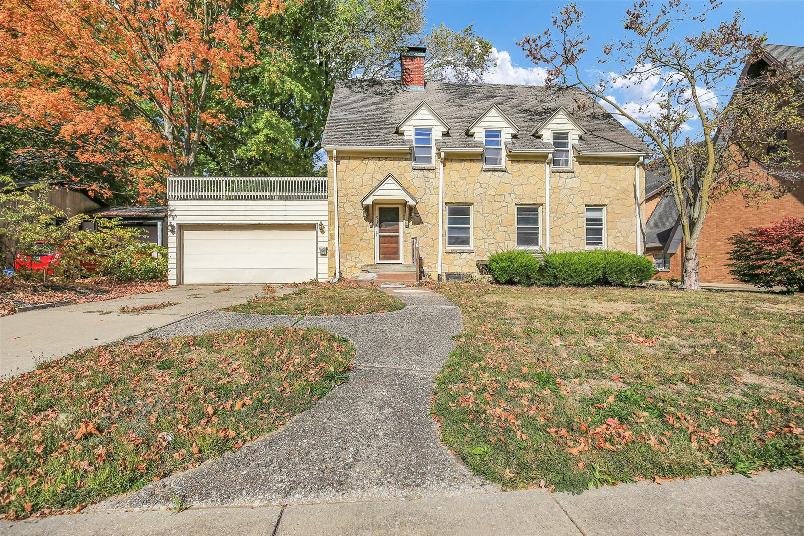 910 West Springfield Avenue Champaign, IL 61821 - Photo 1 of 45 a front view of a house with a yard