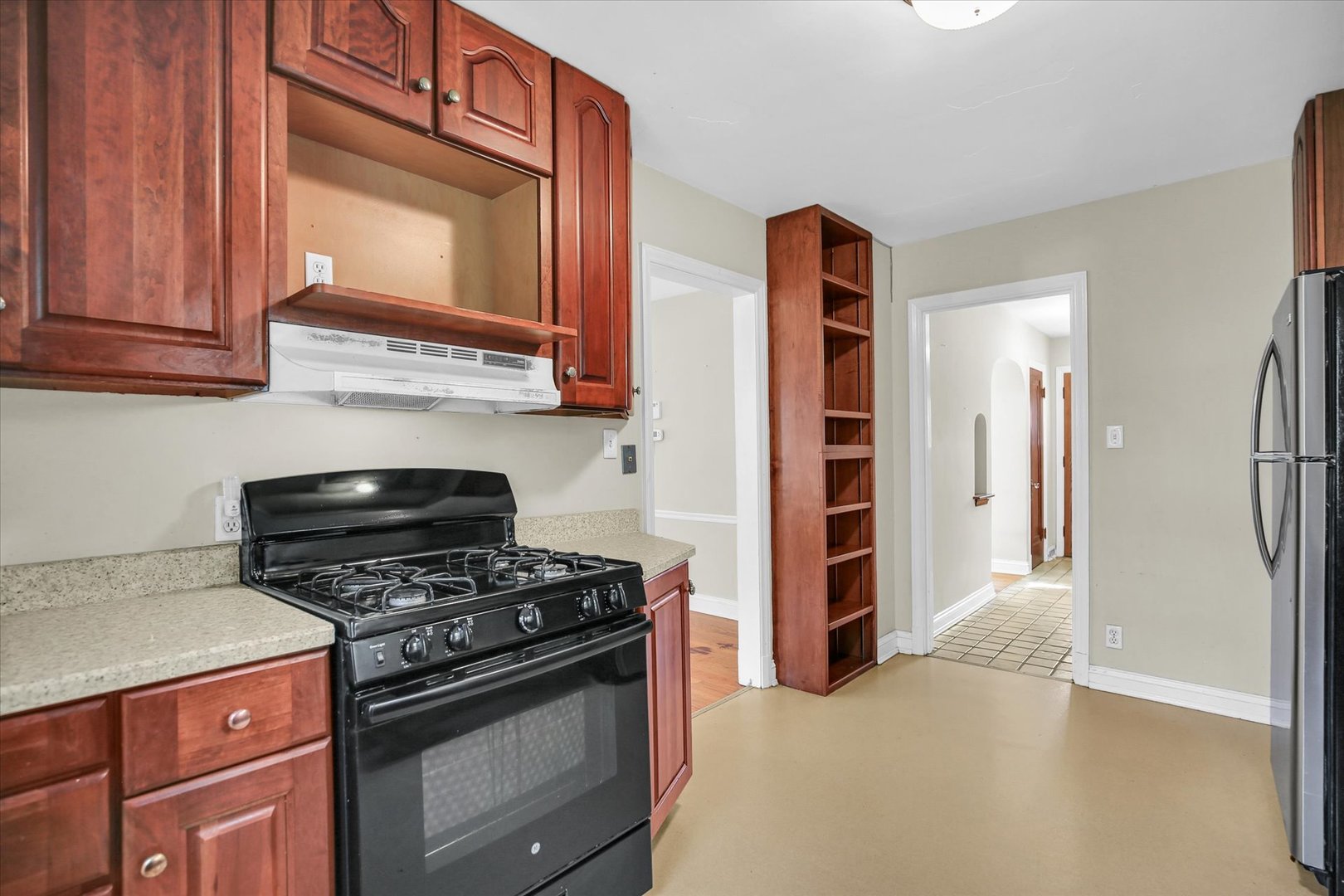 910 West Springfield Avenue Champaign, IL 61821 - Photo 13 of 45 a kitchen with cabinets and appliances