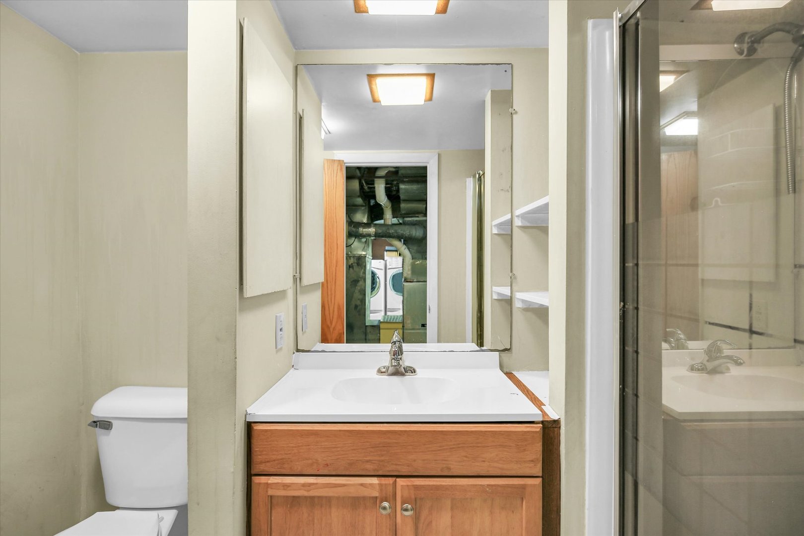 910 West Springfield Avenue Champaign, IL 61821 - Photo 39 of 45 a bathroom with a sink and a mirror